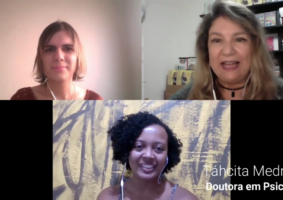 Foto da entrevista com Táhcita Mizael, no Canal Mundo Autista, no Youtube. Sobre: Atravessamentos de raça, gênero e classe no autismo